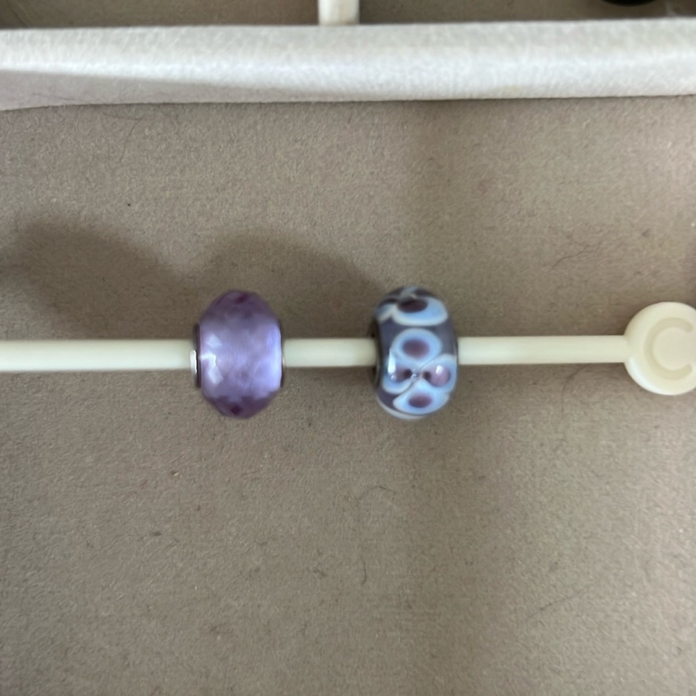 Marano, glass, flower bead and a cut glass bead that is similar to Alexandrite.
